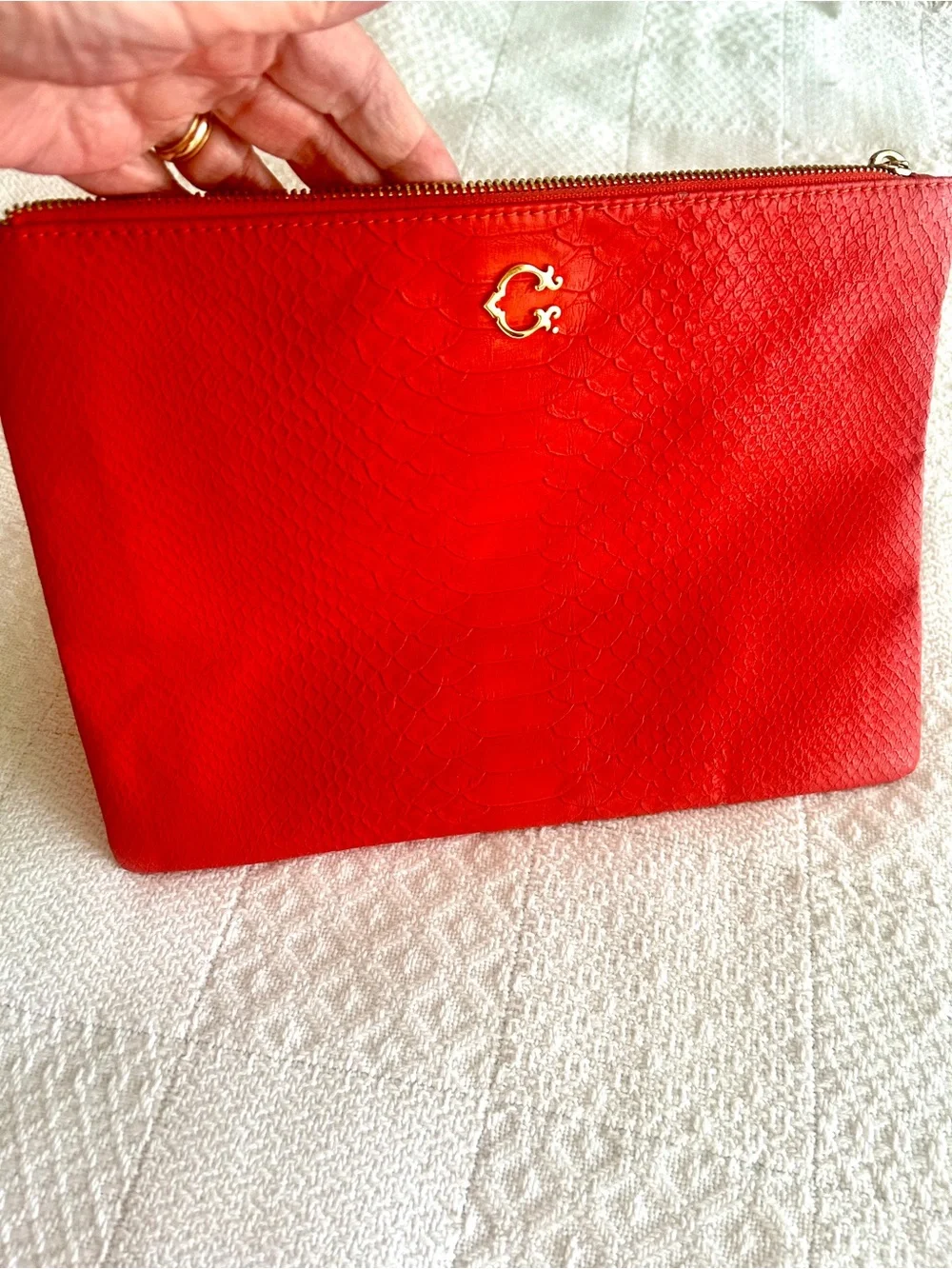 C. Wonder Clutch Orange Red Embossed Print Zip Close with Gold C Emblem
